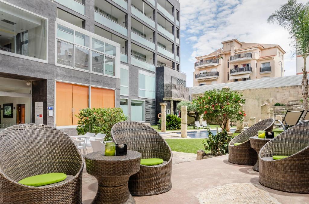 Posedenie v ubytovaní Exe Cunit Suites & Spa
