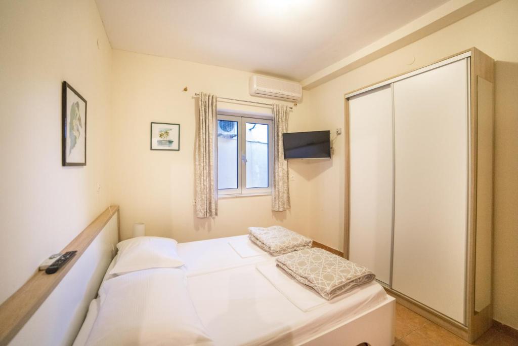 Postel nebo postele na pokoji v ubytování Apartment Cvita