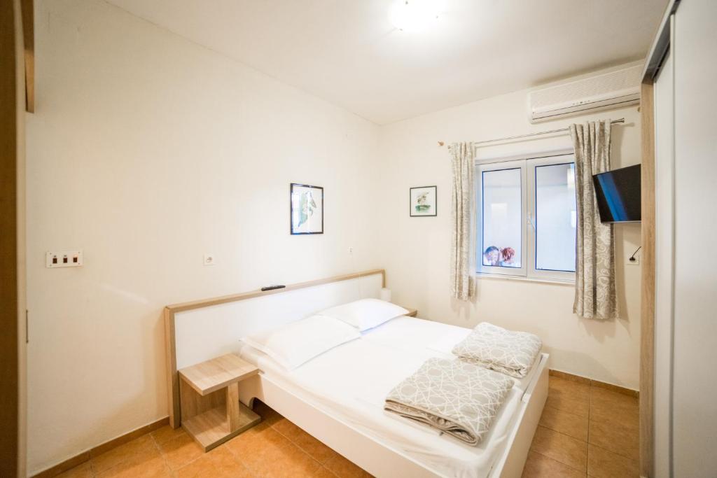 Postel nebo postele na pokoji v ubytování Apartment Cvita