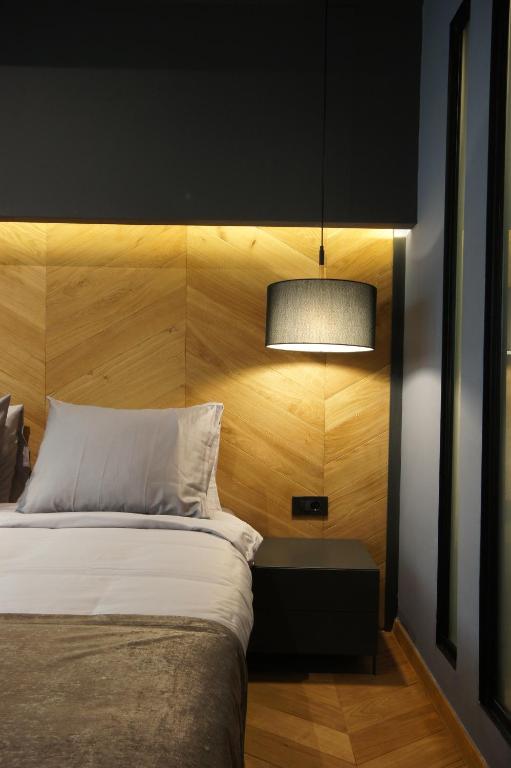Postel nebo postele na pokoji v ubytování Hotel London B&B