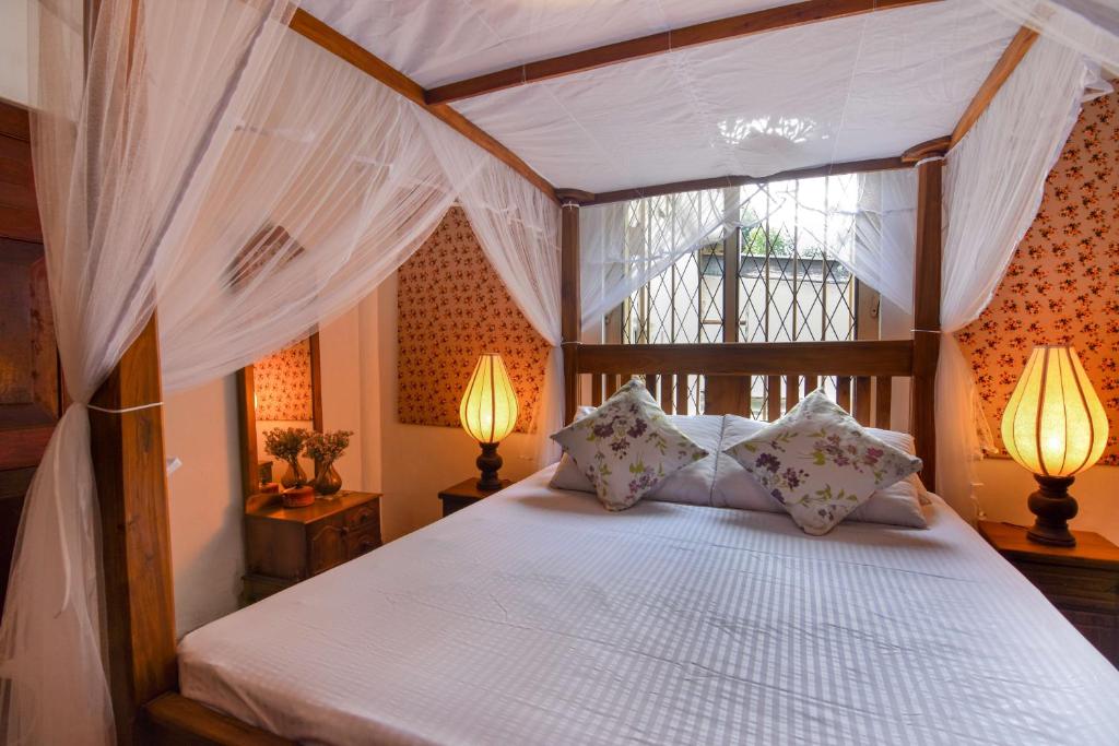 Een bed of bedden in een kamer bij Ceylon Boutique Homestay Kandy