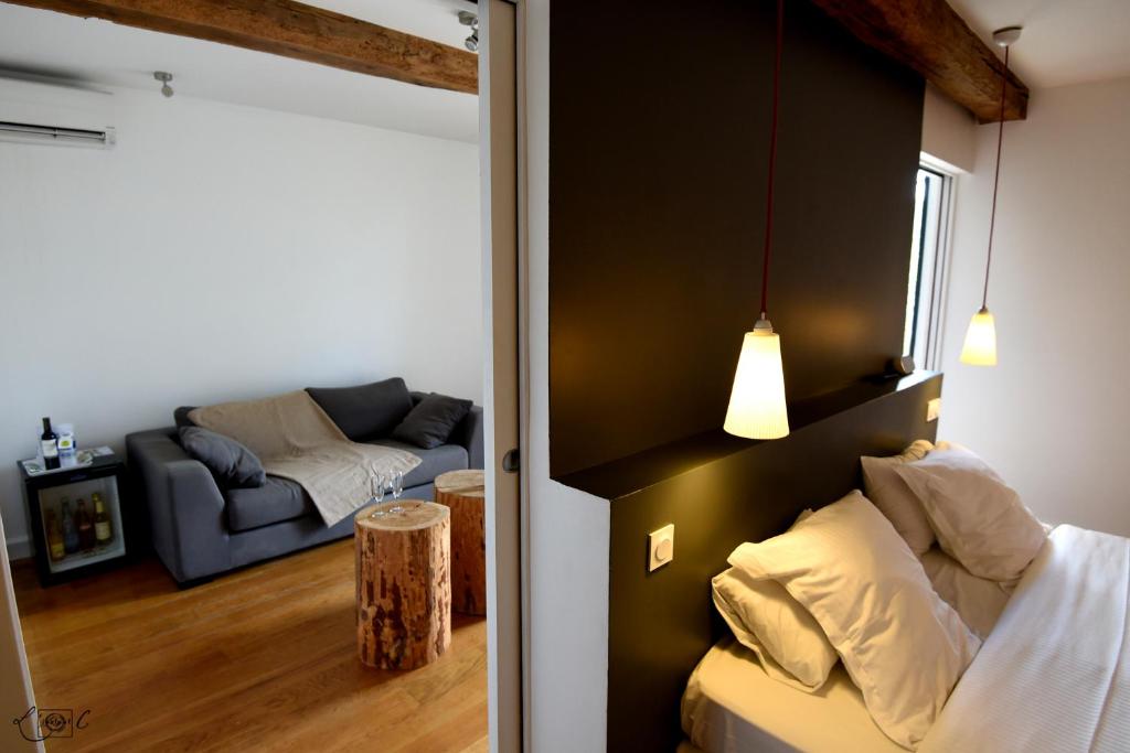 Postel nebo postele na pokoji v ubytování Le Domaine de Baulieu, Singuliers Hotels