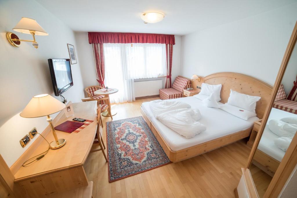Postel nebo postele na pokoji v ubytování Hotel Pra Tlusel