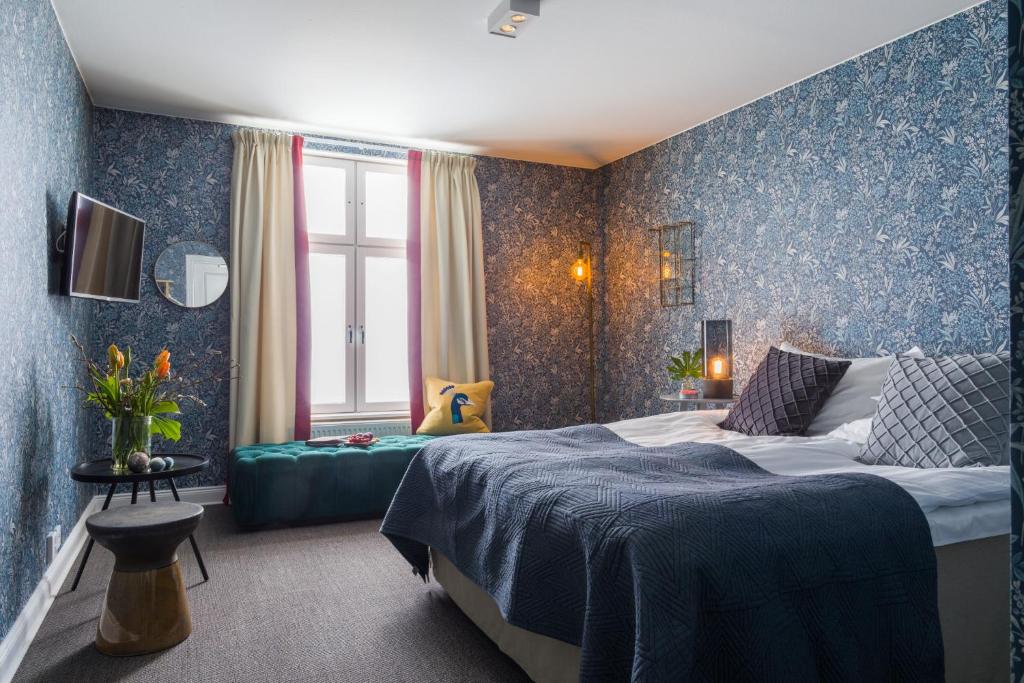 Postel nebo postele na pokoji v ubytování Smådalarö Gård Hotell & Spa