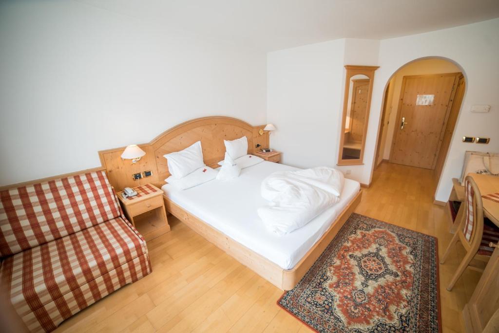 Postel nebo postele na pokoji v ubytování Hotel Pra Tlusel