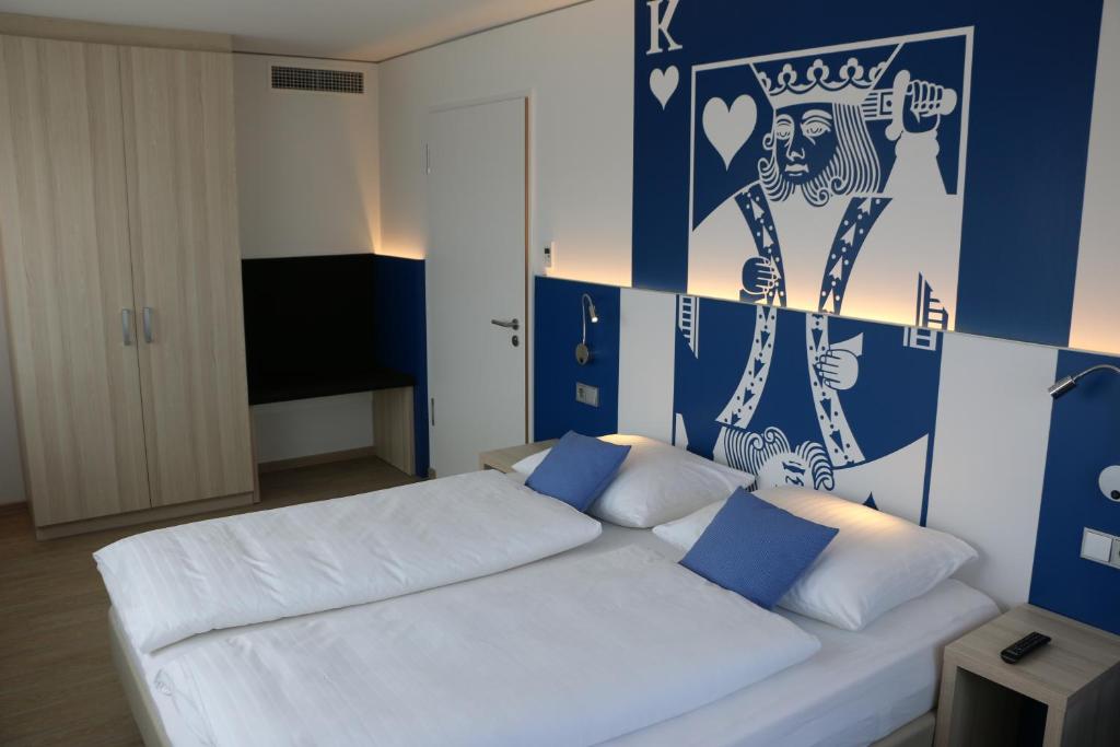 Postel nebo postele na pokoji v ubytování Aparthotel Paderborn