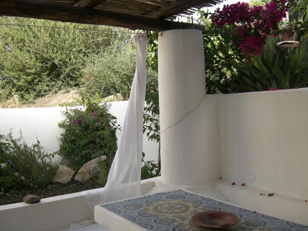 a white room with a table and a white wall at Cottage in Panarea in Panarea