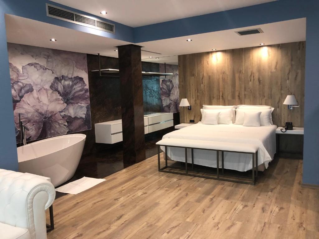 Postel nebo postele na pokoji v ubytování Hotel Palace