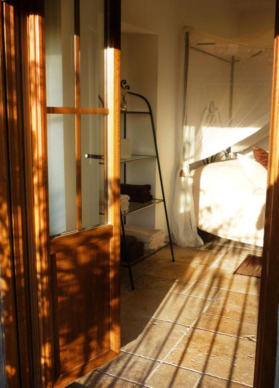 Postel nebo postele na pokoji v ubytování Aux Bords du Temps