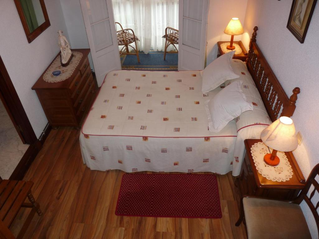A bed or beds in a room at Hospedaje Roiz