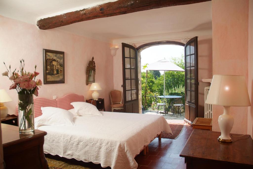 Postel nebo postele na pokoji v ubytování Les Orangers