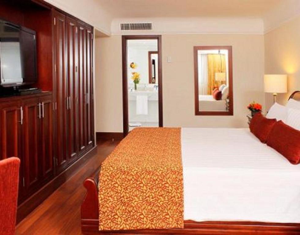 Postel nebo postele na pokoji v ubytování Hotel Estelar La Fontana