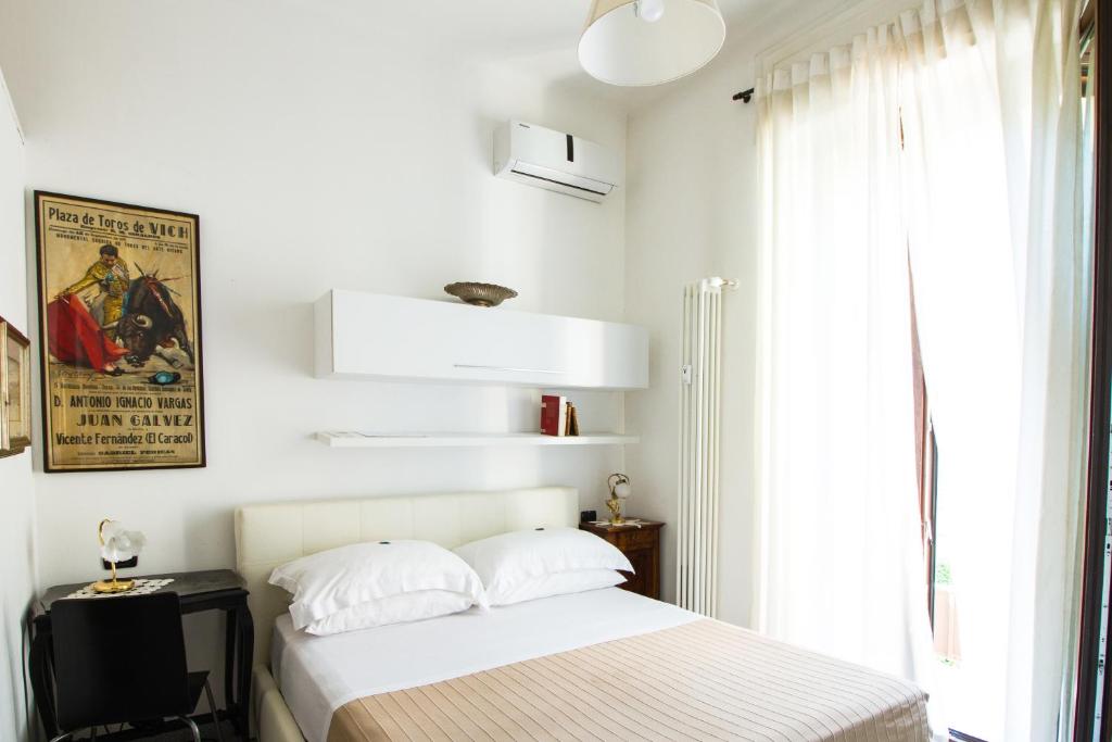 Postel nebo postele na pokoji v ubytování Aiello Suites Milan