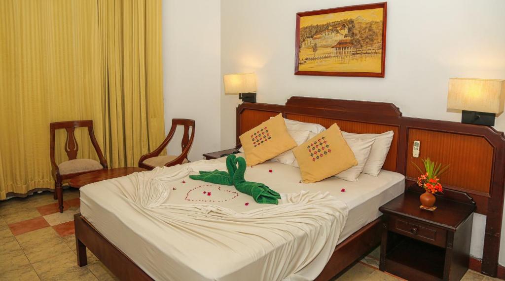 Postel nebo postele na pokoji v ubytování Senani Hotel
