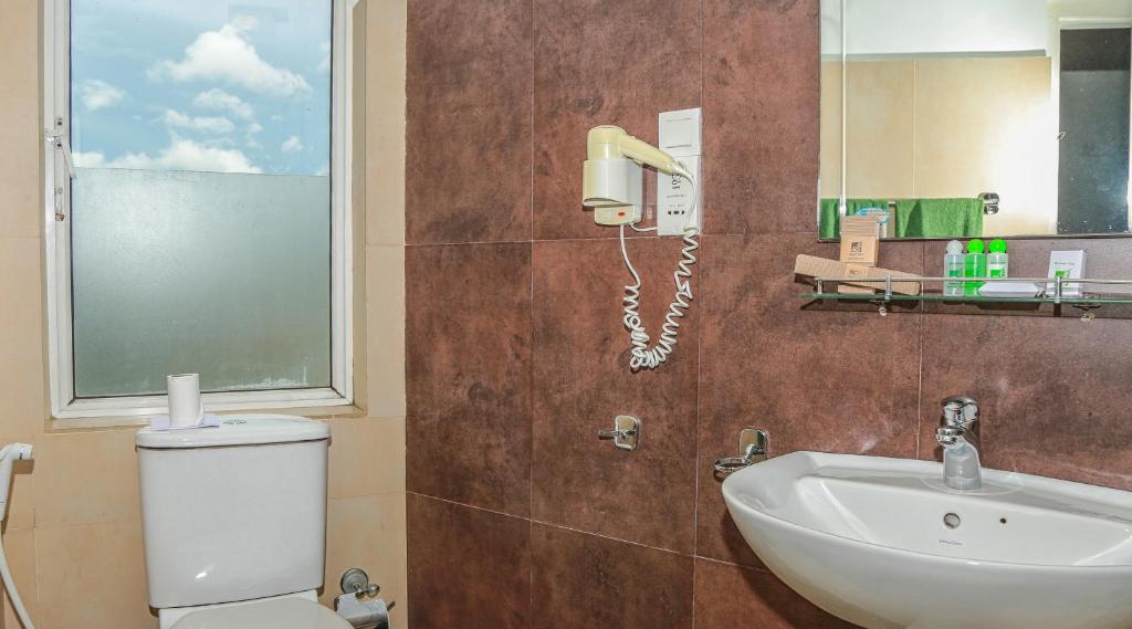 Koupelna v ubytování Senani Hotel
