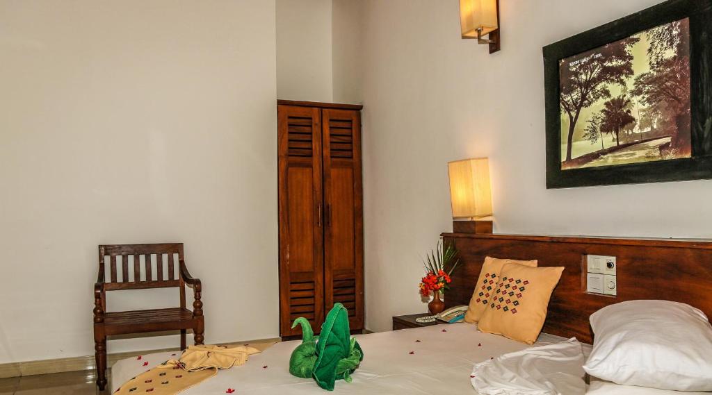 Postel nebo postele na pokoji v ubytování Senani Hotel