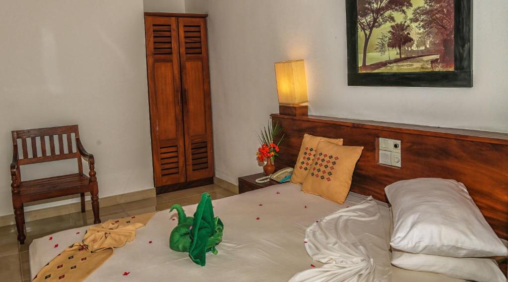 Postel nebo postele na pokoji v ubytování Senani Hotel