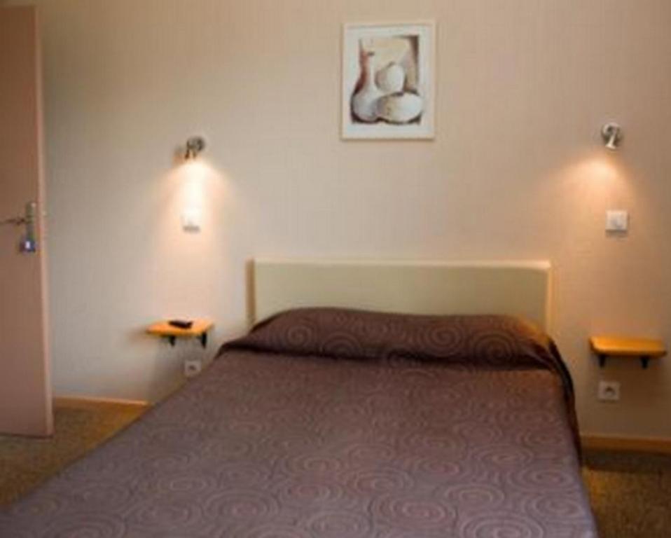Postel nebo postele na pokoji v ubytování Les Orangers