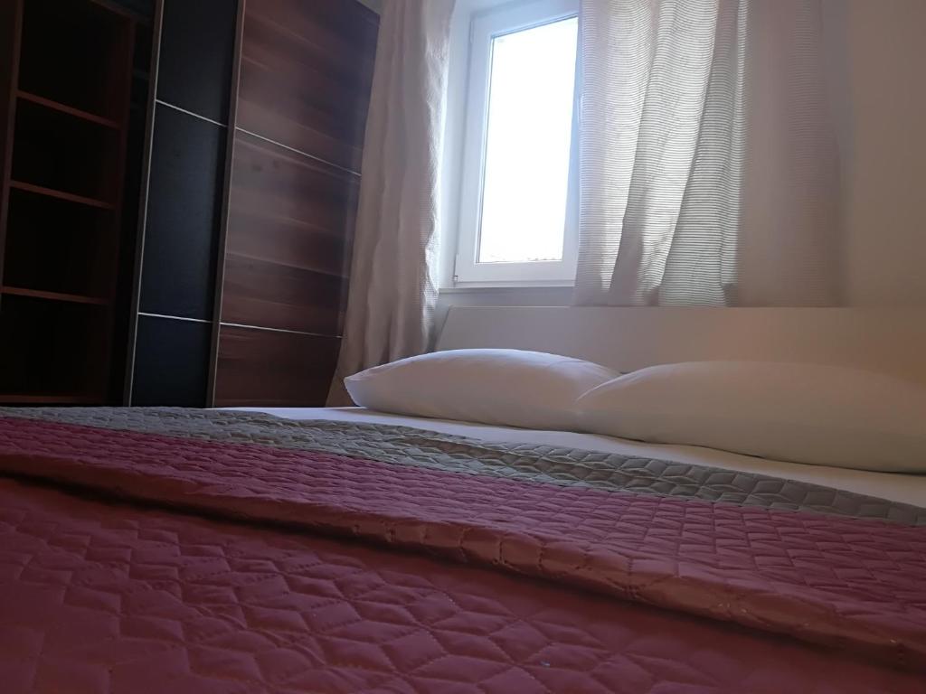 Posteľ alebo postele v izbe v ubytovaní Apartman Brzović
