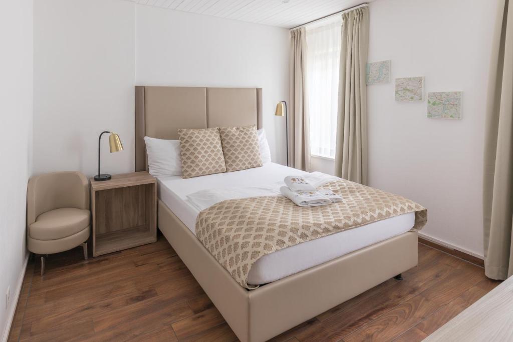Postel nebo postele na pokoji v ubytování Residence Mutschellen