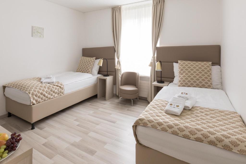 Postel nebo postele na pokoji v ubytování Residence Mutschellen
