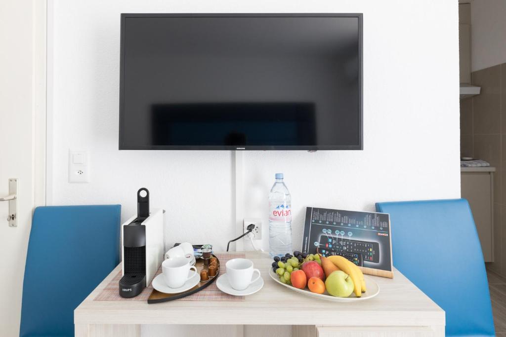 TV a/nebo společenská místnost v ubytování Residence Mutschellen