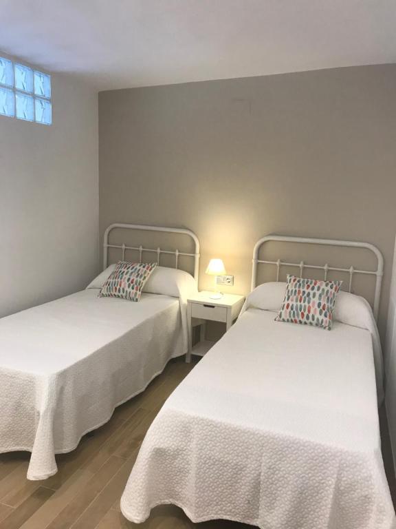 Postel nebo postele na pokoji v ubytování Apartamento frente al mar