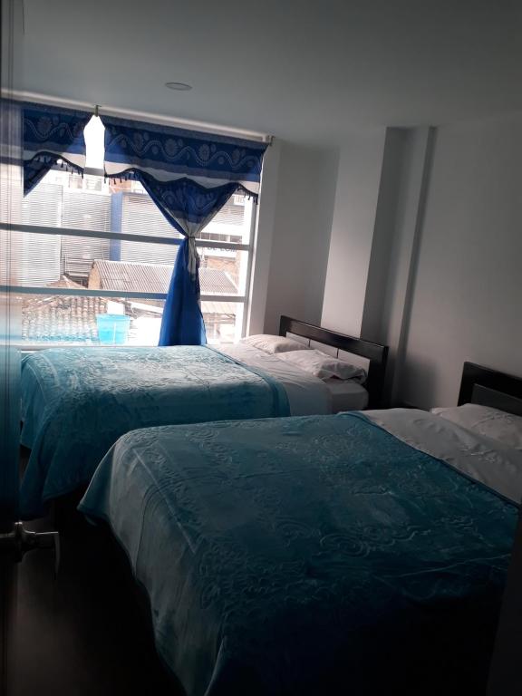 Postel nebo postele na pokoji v ubytování Hotel Royal Class