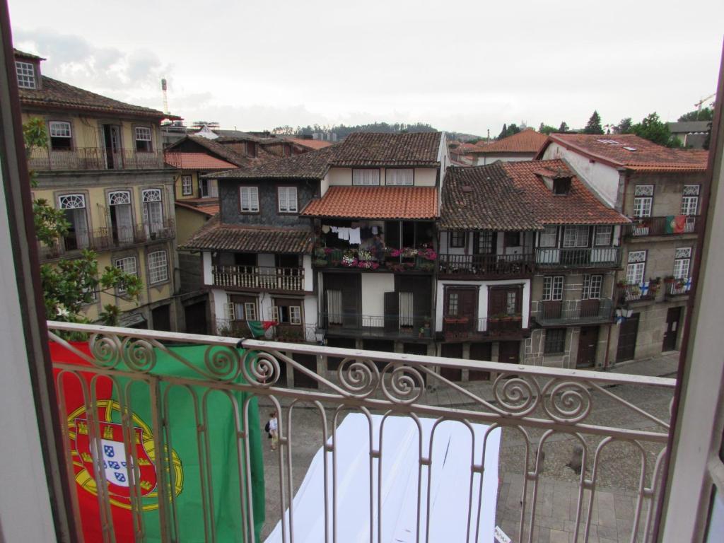 a view of a city from a balcony with buildings at Santiago 31 Hostel in Guimarães