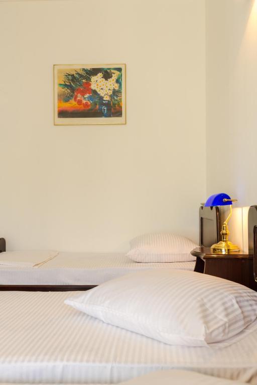 Postel nebo postele na pokoji v ubytování Hotel Simpatia