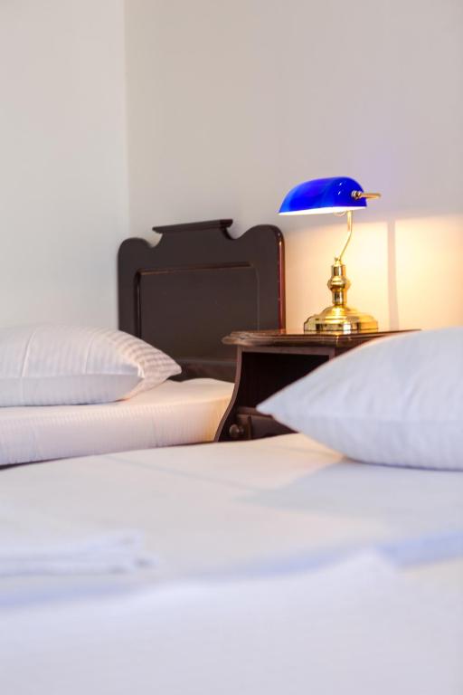 Postel nebo postele na pokoji v ubytování Hotel Simpatia