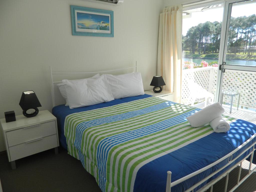 Postel nebo postele na pokoji v ubytování Isle Of Palms Resort
