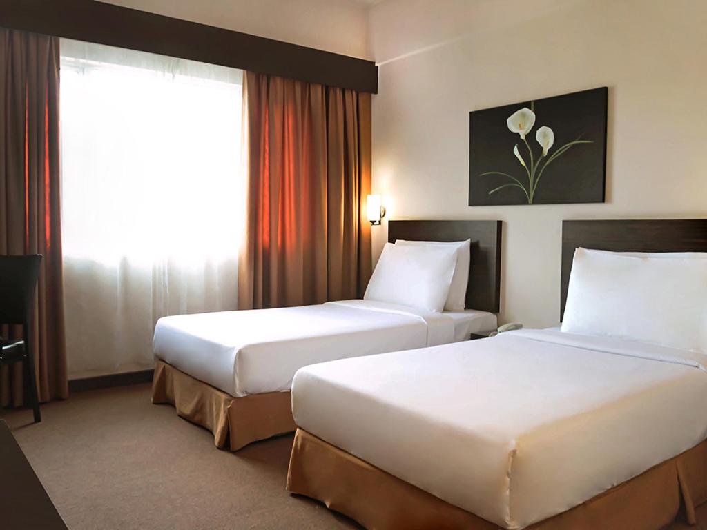 Postel nebo postele na pokoji v ubytování Hotel Summer View