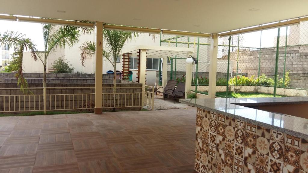 a patio with a table and a counter top at Residencial Montreal in Cuiabá