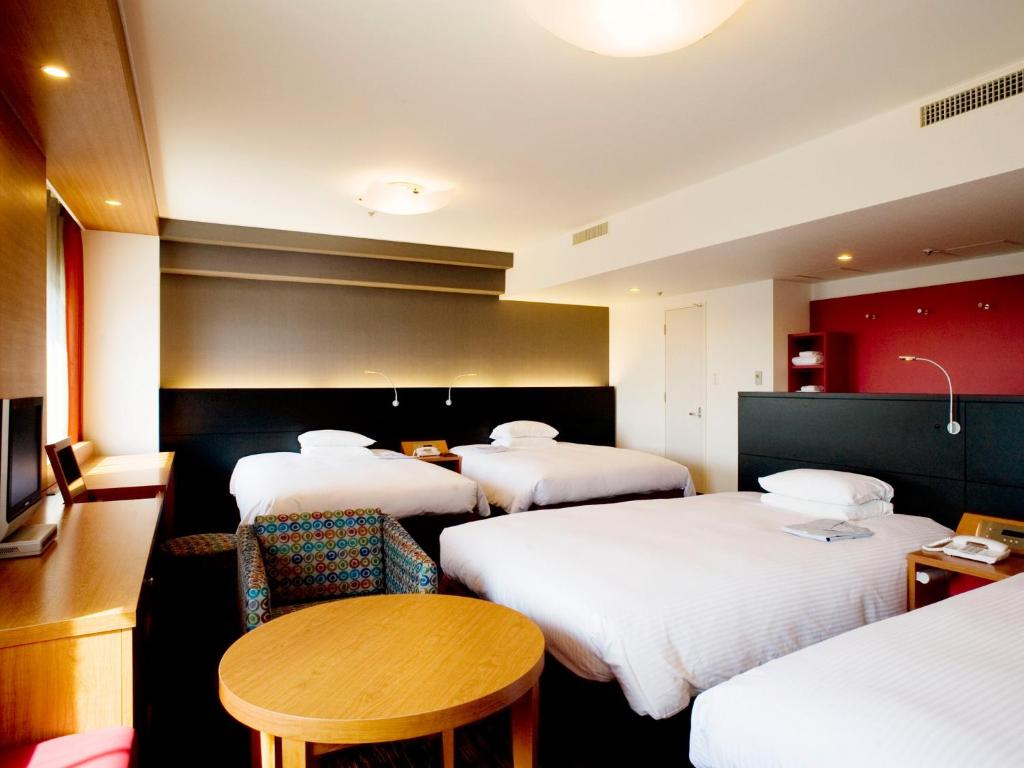 Postel nebo postele na pokoji v ubytování Hotel Nikko Narita