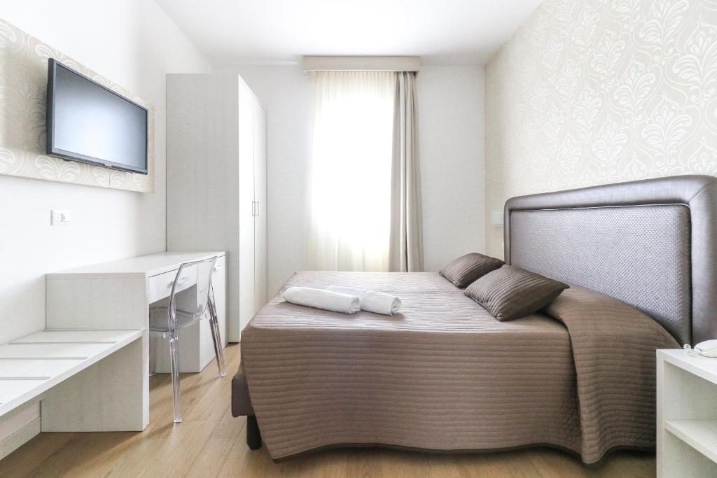 Postel nebo postele na pokoji v ubytování Hotel Jesulum