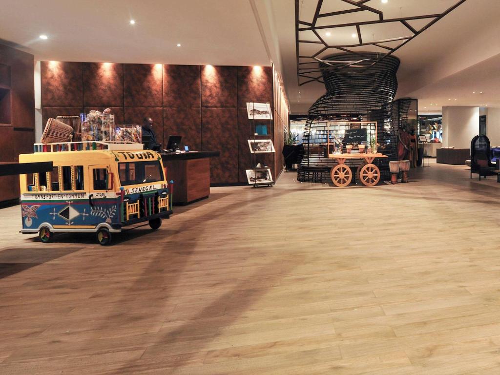 a store with a toy truck on display in a room at Pullman Dakar Teranga in Dakar