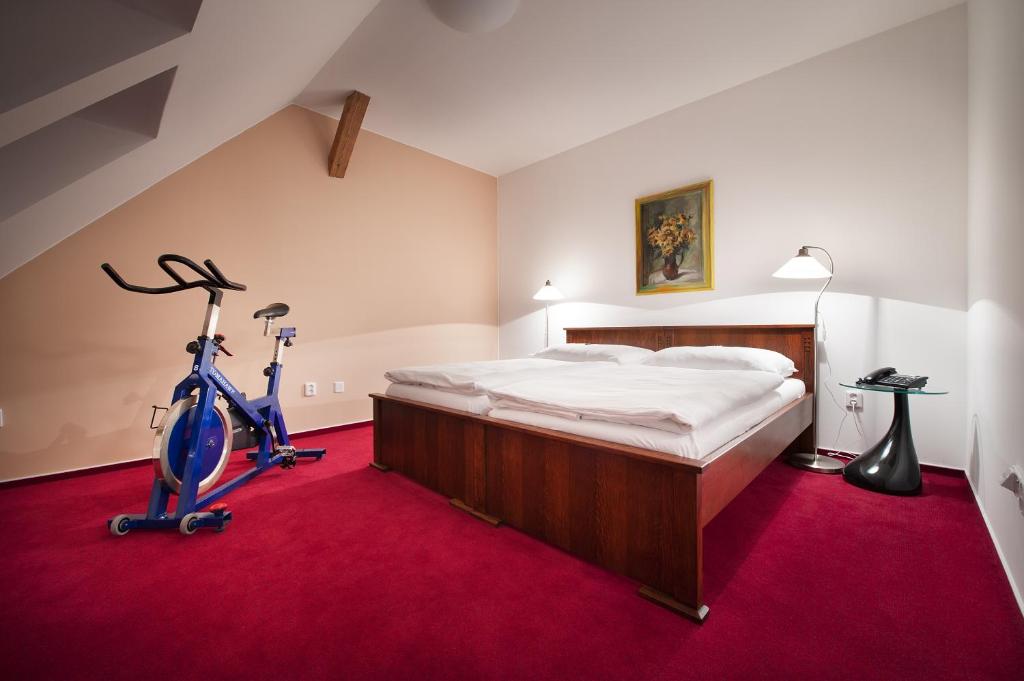 Postel nebo postele na pokoji v ubytování Brioni Suites