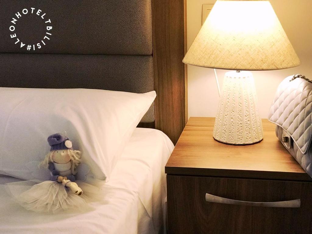 Postel nebo postele na pokoji v ubytování Aleon Hotel
