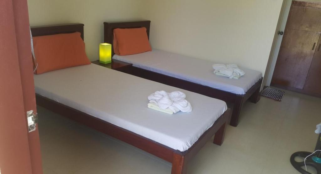 Letto o letti in una camera di SLAM'S Garden Dive Resort
