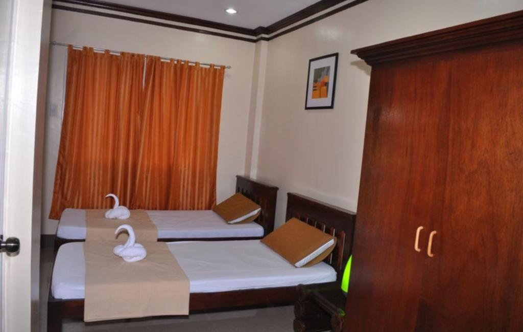 Letto o letti in una camera di SLAM'S Garden Dive Resort