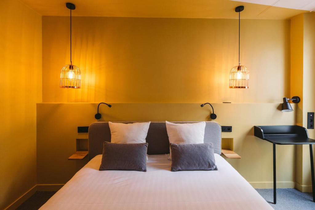 Postel nebo postele na pokoji v ubytování Le Petit Cosy Hôtel