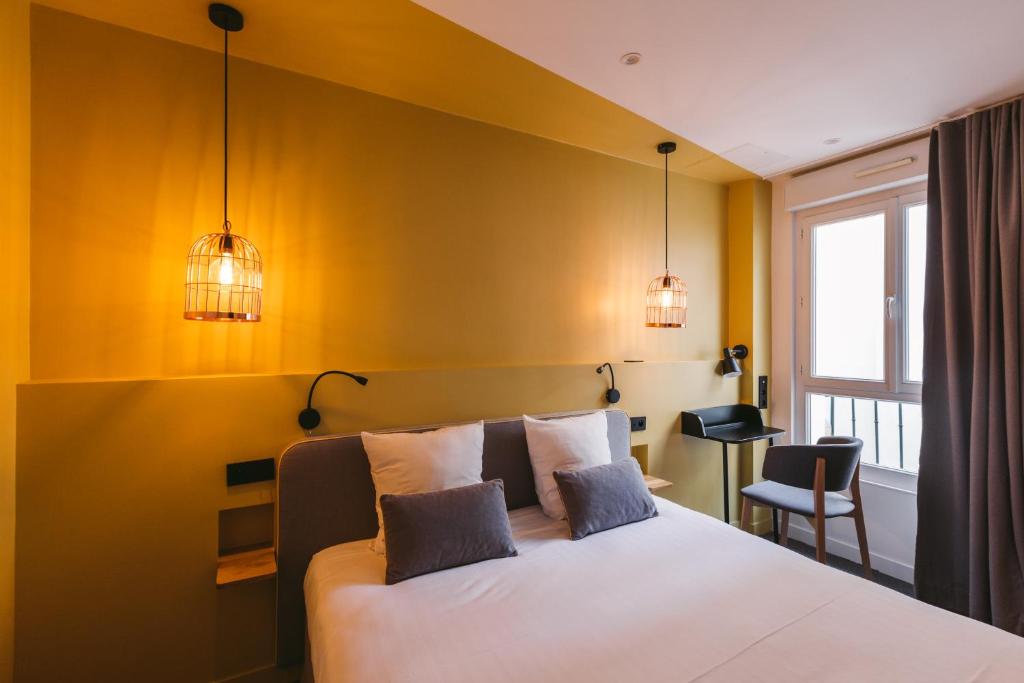 Postel nebo postele na pokoji v ubytování Le Petit Cosy Hôtel