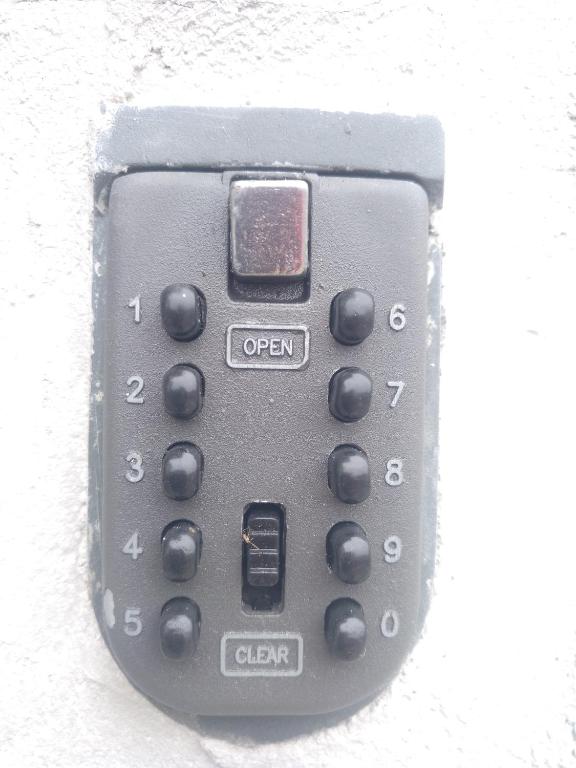 a close up of a remote control on a wall at Apartamentos turísticos Vistademar in Luarca