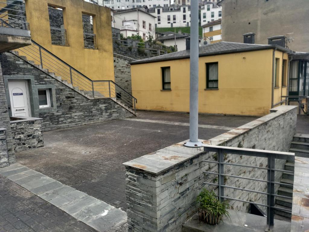 an empty parking lot in a city with buildings at Apartamentos turísticos Vistademar in Luarca