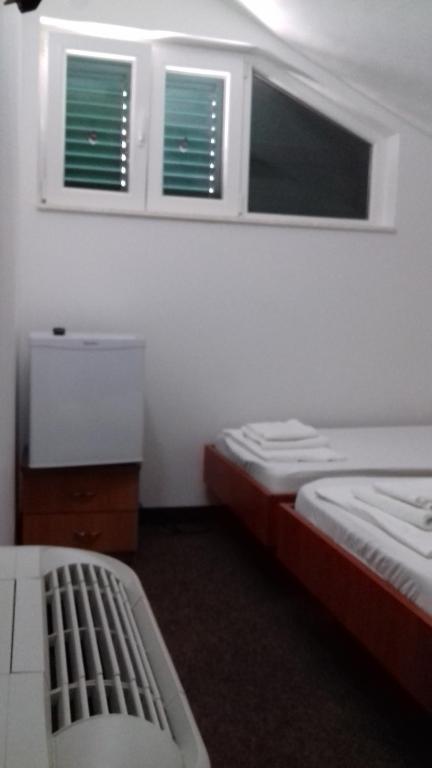 Postel nebo postele na pokoji v ubytování Guest House Babić