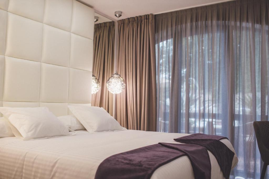 Postel nebo postele na pokoji v ubytování Hotel Cuevas - Adults Only