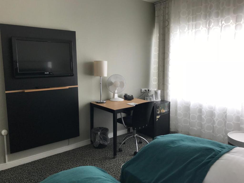 Postel nebo postele na pokoji v ubytování Glostrup Park Hotel