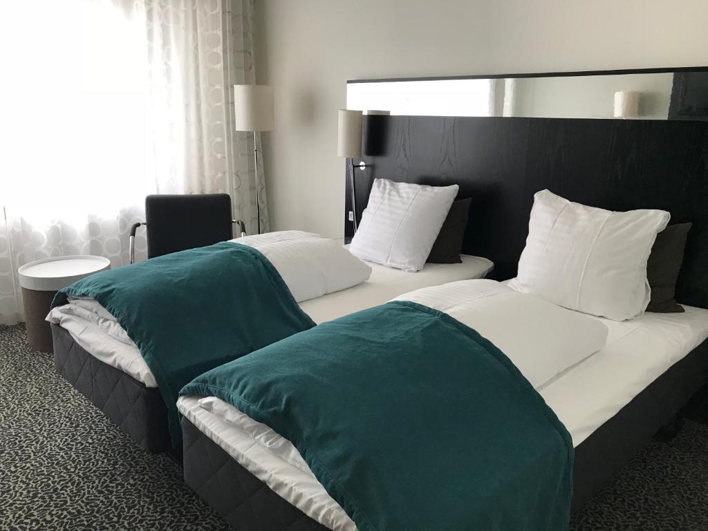 Postel nebo postele na pokoji v ubytování Glostrup Park Hotel
