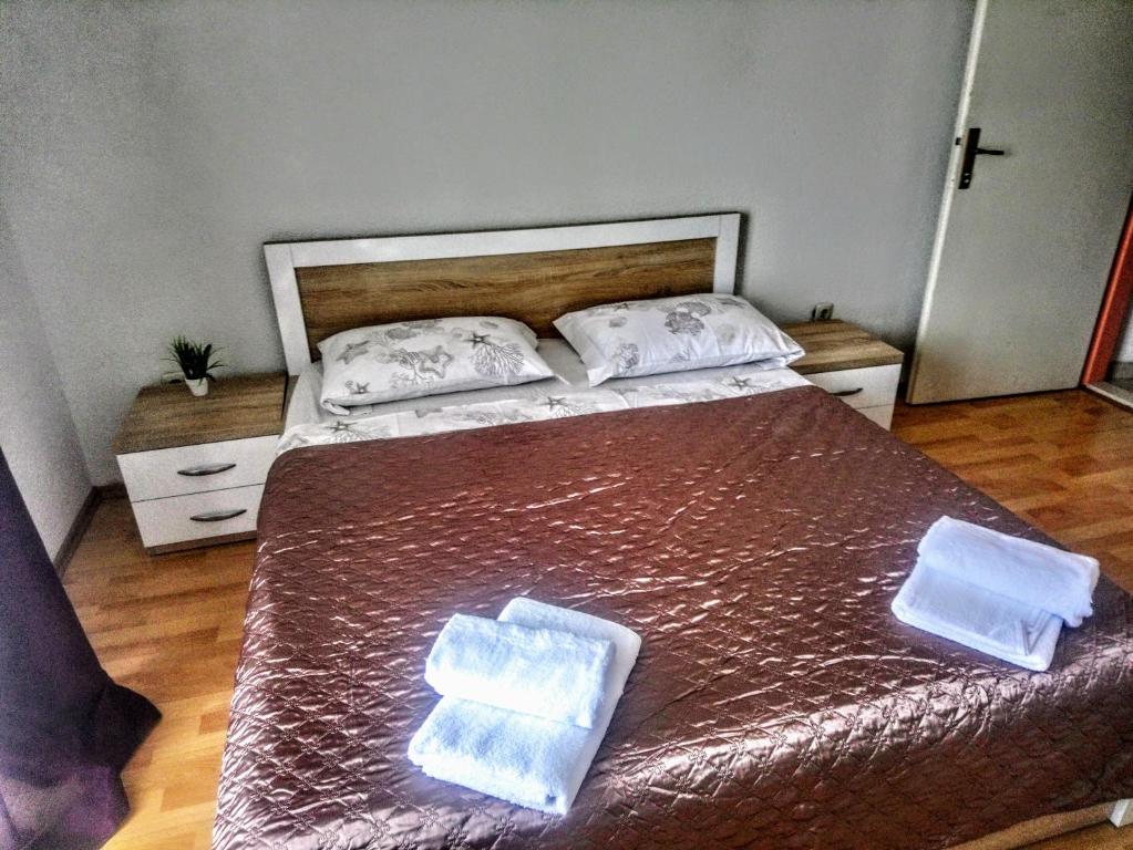 Postel nebo postele na pokoji v ubytování Apartmani Five